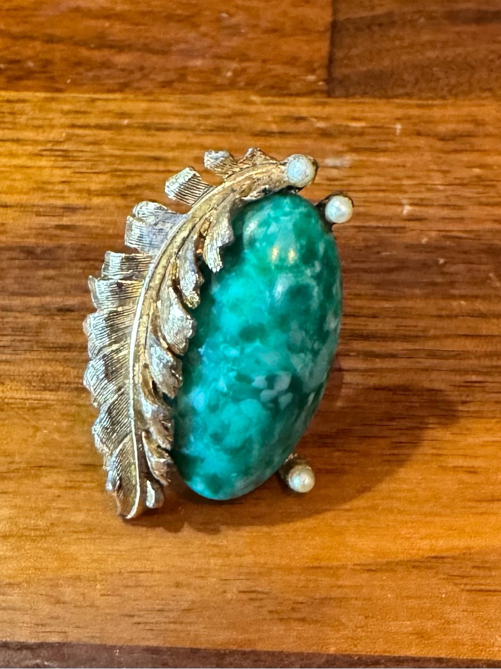 vintage Navajo-style ring features a green turquoise stone